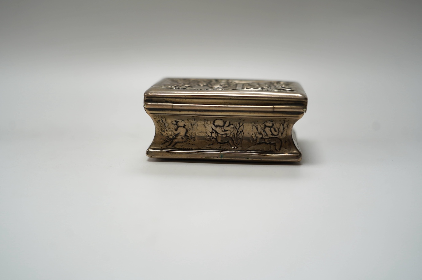 A late 19th century Dutch embossed white metal rectangular snuff box, 83mm, 107 grams. Condition - poor